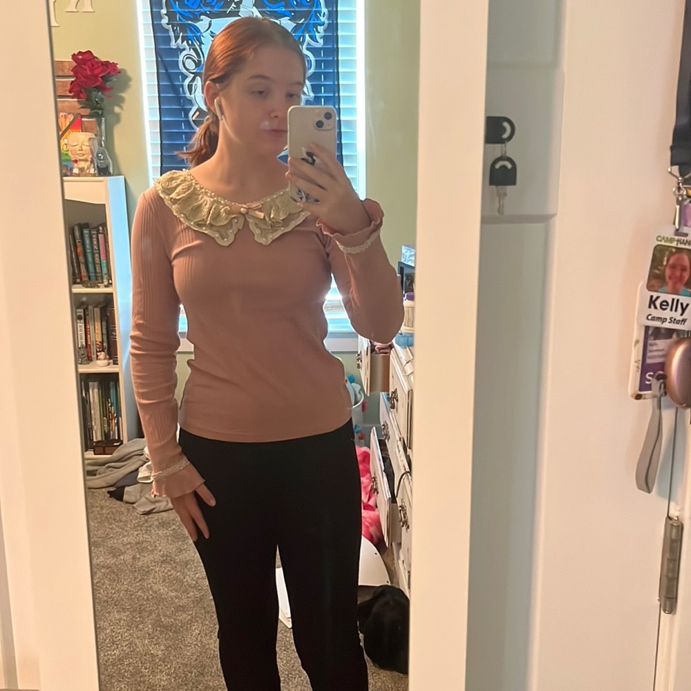 “Axes” blouse. No size tag (probably s). Muted pink color with lace trim.